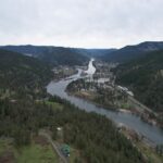 River running through an Idaho mountain valley, representative of Moose Creek Ranch