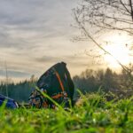 Backpack and camp chair at sunset campsite