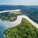Aerial drone landscape over forest and river