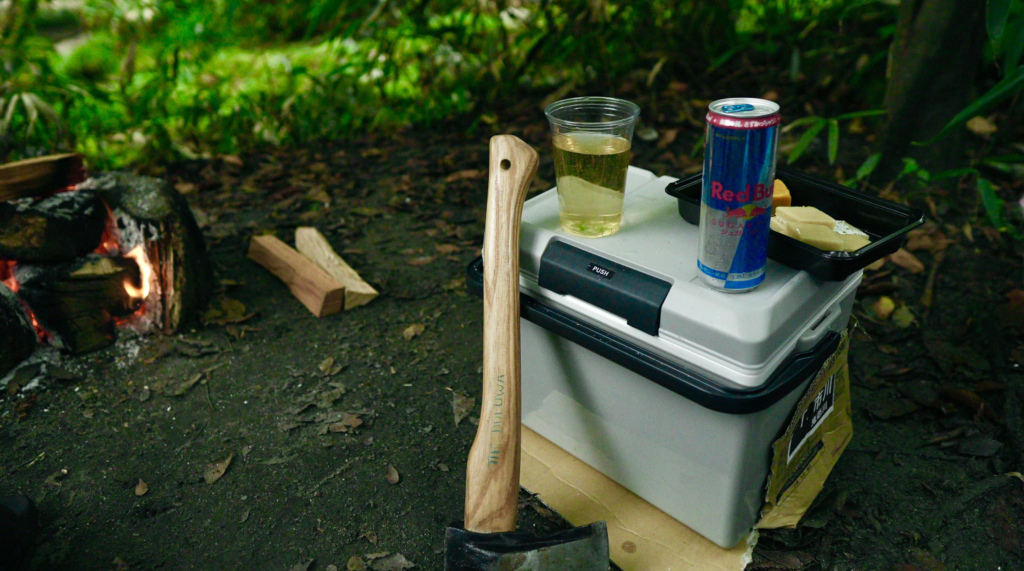 Camping cooler stocked with ice and drinks